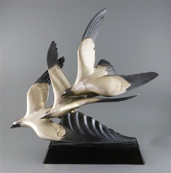 Alexandre Kelety (1918-1940). An Art Deco silvered bronzed group of three seagulls swooping over a wave, L.22in. H.23in.